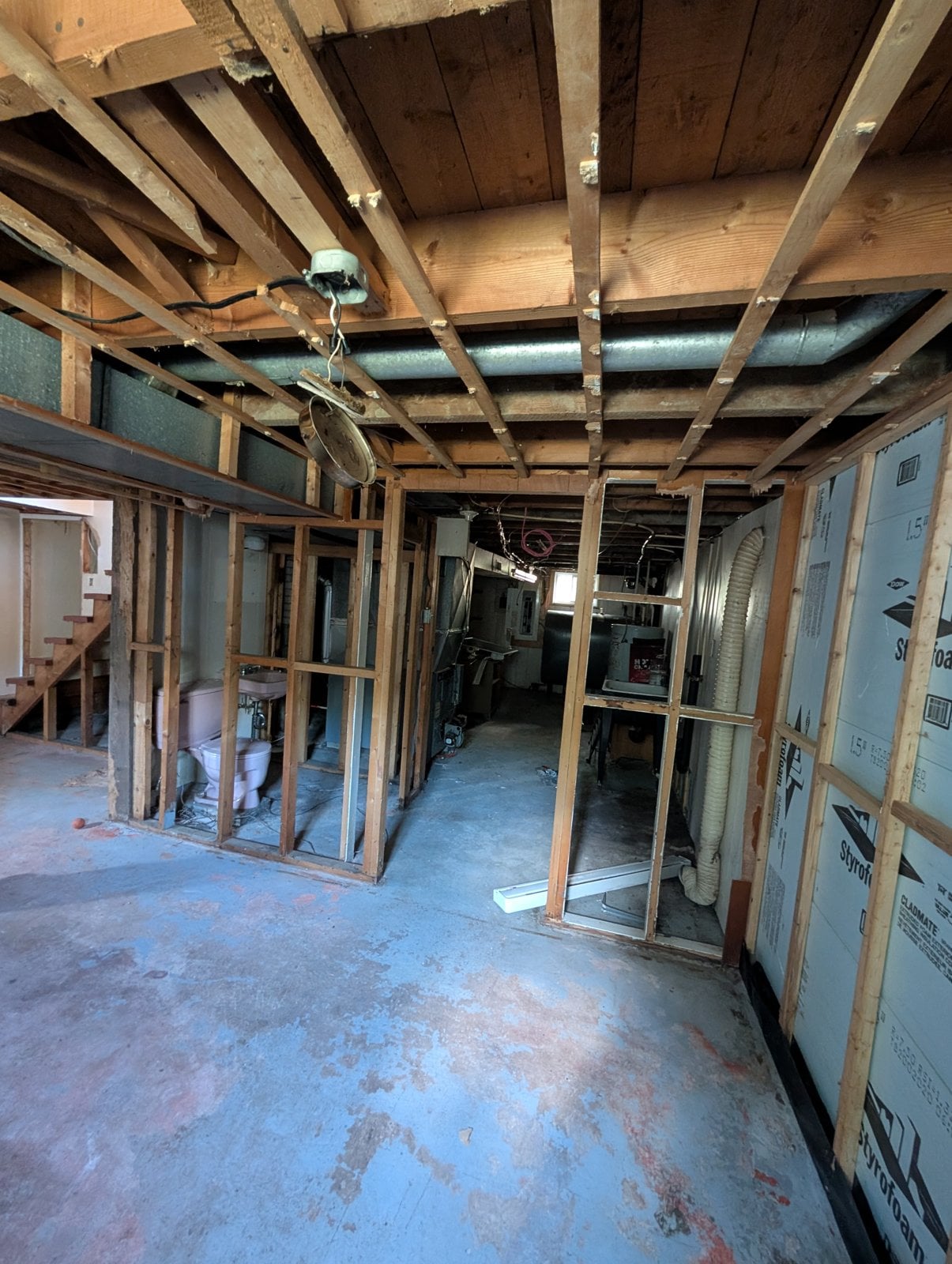 Partition framing in the basement before the work, looking toward the mechanical room